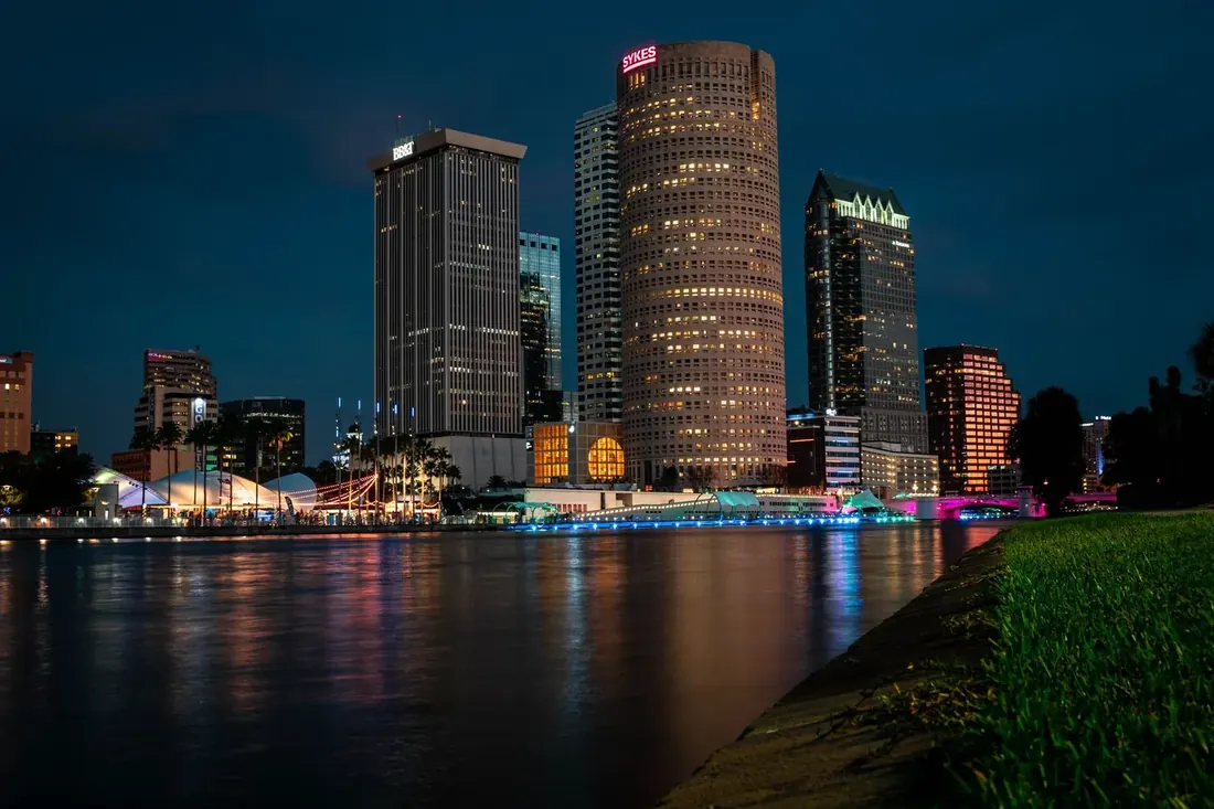 Downtown Tampa skyline at dusk reflected across the water