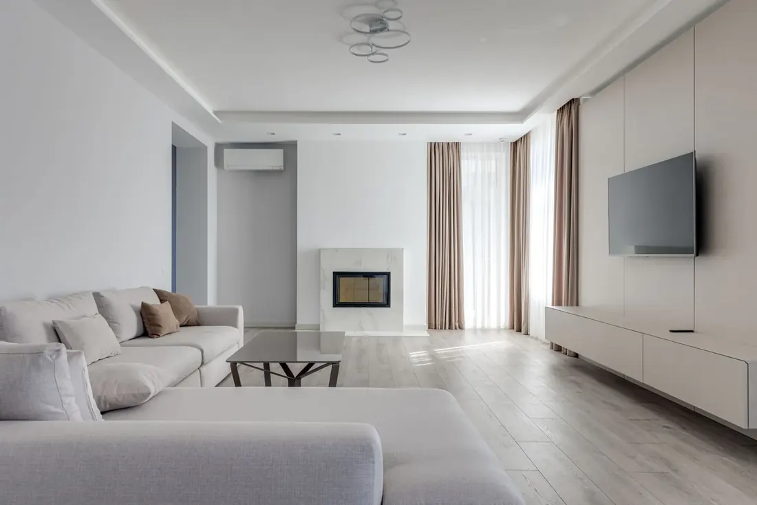 Sunlit living room left calm and clear after a home cleaning visit