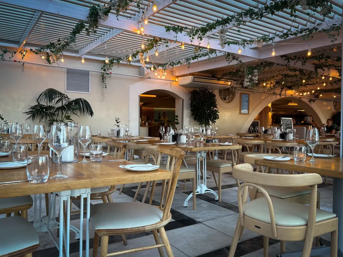 Airy restaurant dining room dressed before service