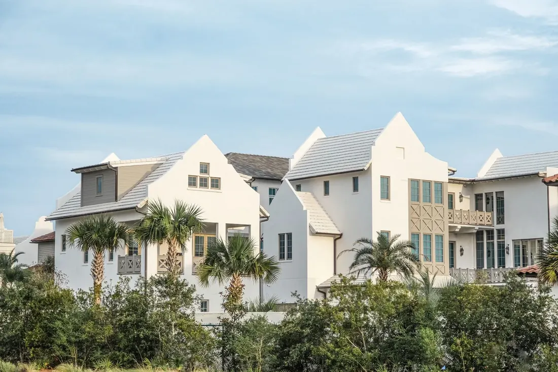 White townhomes with palms, typical of Tampa Bay condo living