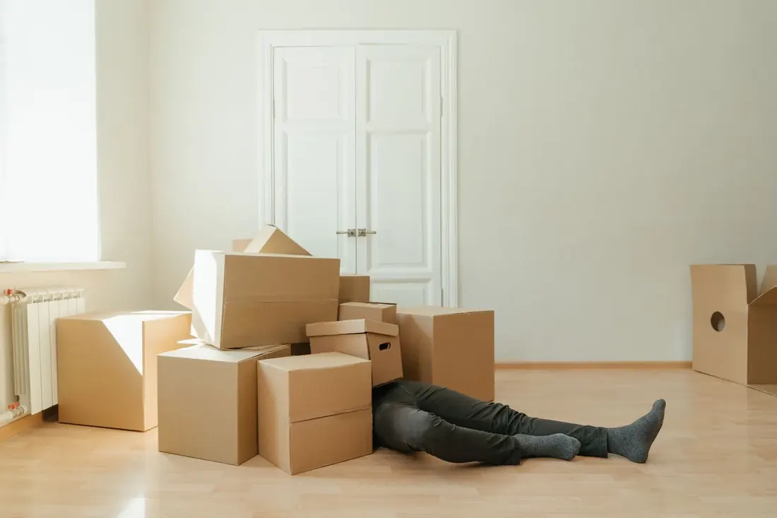 Cardboard boxes waiting in an emptied room before a move out clean